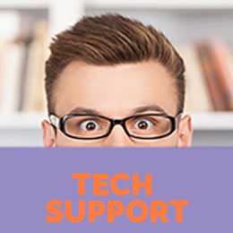 Tech Support Worker sitting behind laptop